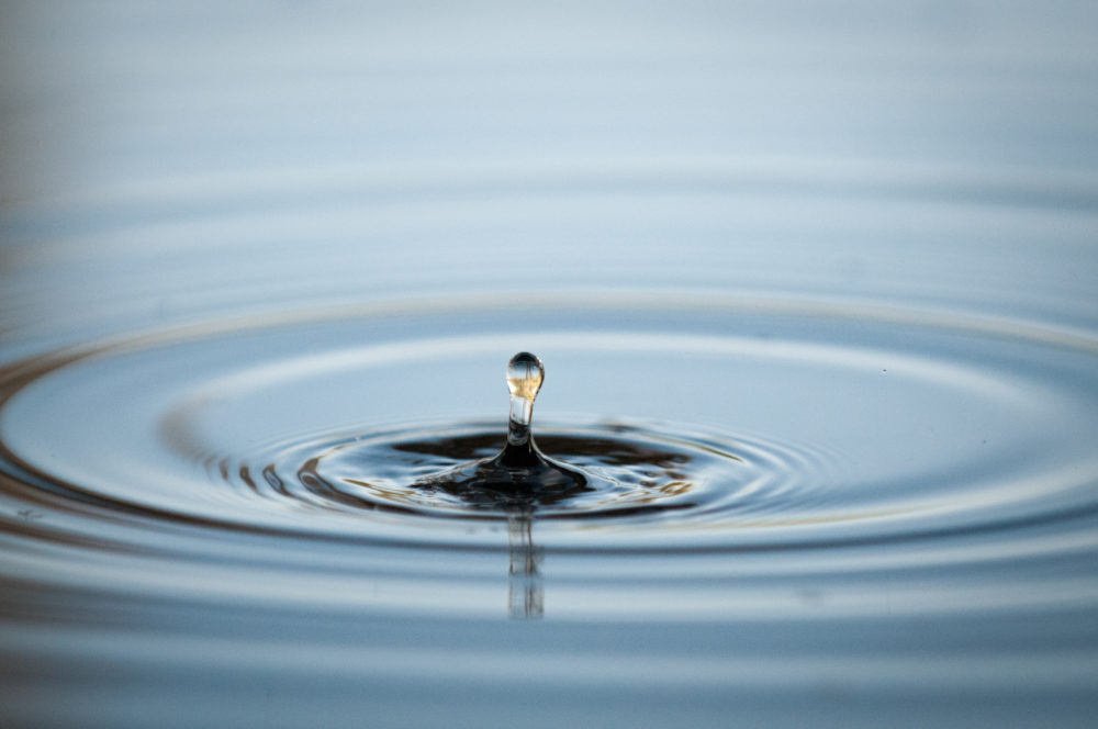 A water droplet splashes in a lake